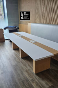 cool two tone custom runway table install 2023 in durable laminate with power and data for hybrid working office or home